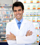 portrait of a male pharmacist at pharmacy